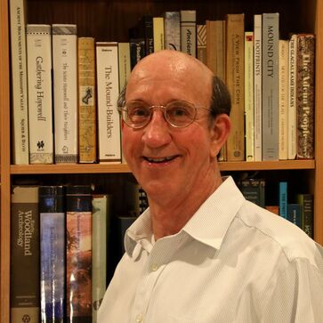 Picture of Christopher Carr, Ph.D. in front of a bookshelf